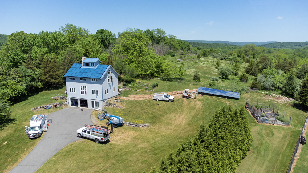 The completed install with both solar arrays on the property Beautiful solar panels on both the house and the ground mount