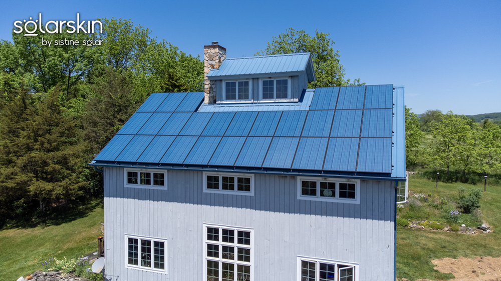 The vivid blue is here to stay! Solar panels on the roof blend in with the blue metal roof
