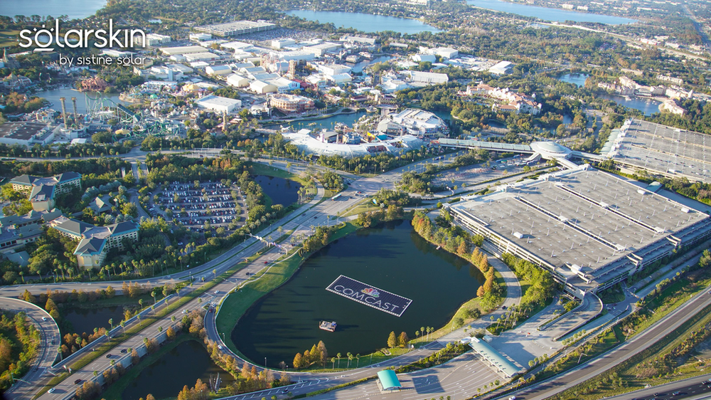 Floating solar array equipped with SolarSkin™ — photo credit: @bioreconstruct on Twitter Comcast logo design across SolarSkin on floating solar array at Universal Studios Orlando