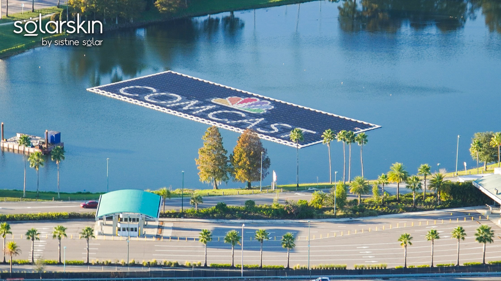 Comcast logo powered by SolarSkin on floating solar array